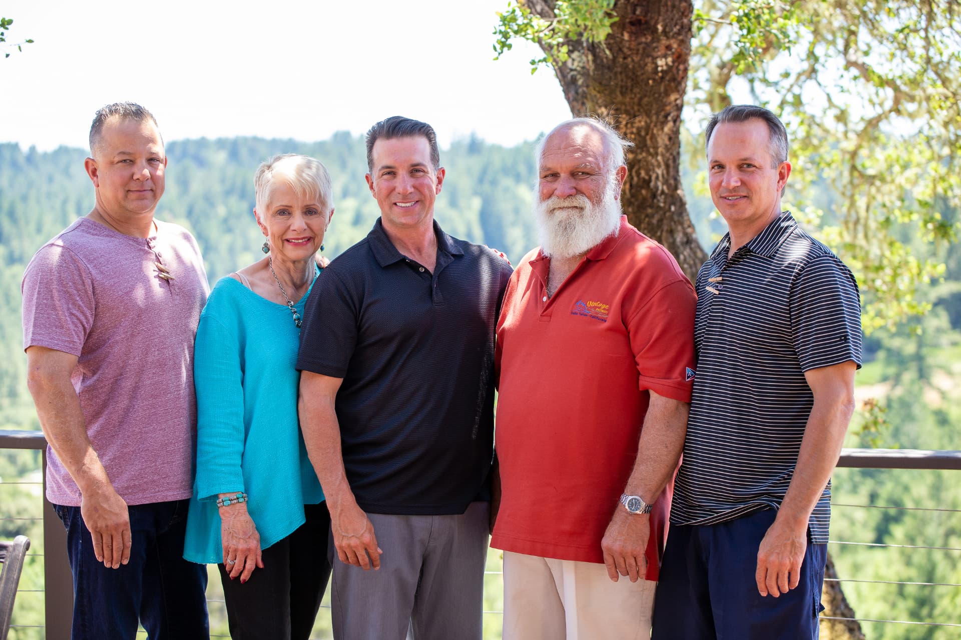 Andre, Gloria and their three sons standing together outdoors