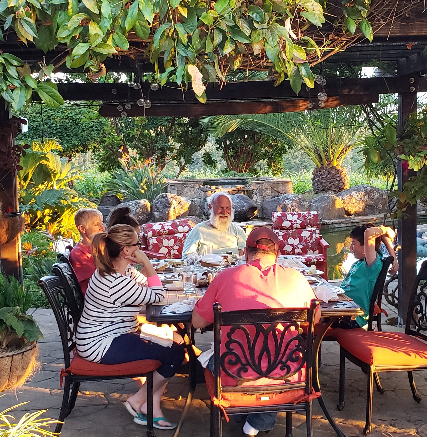 Friends and family gathered around an outdoor table