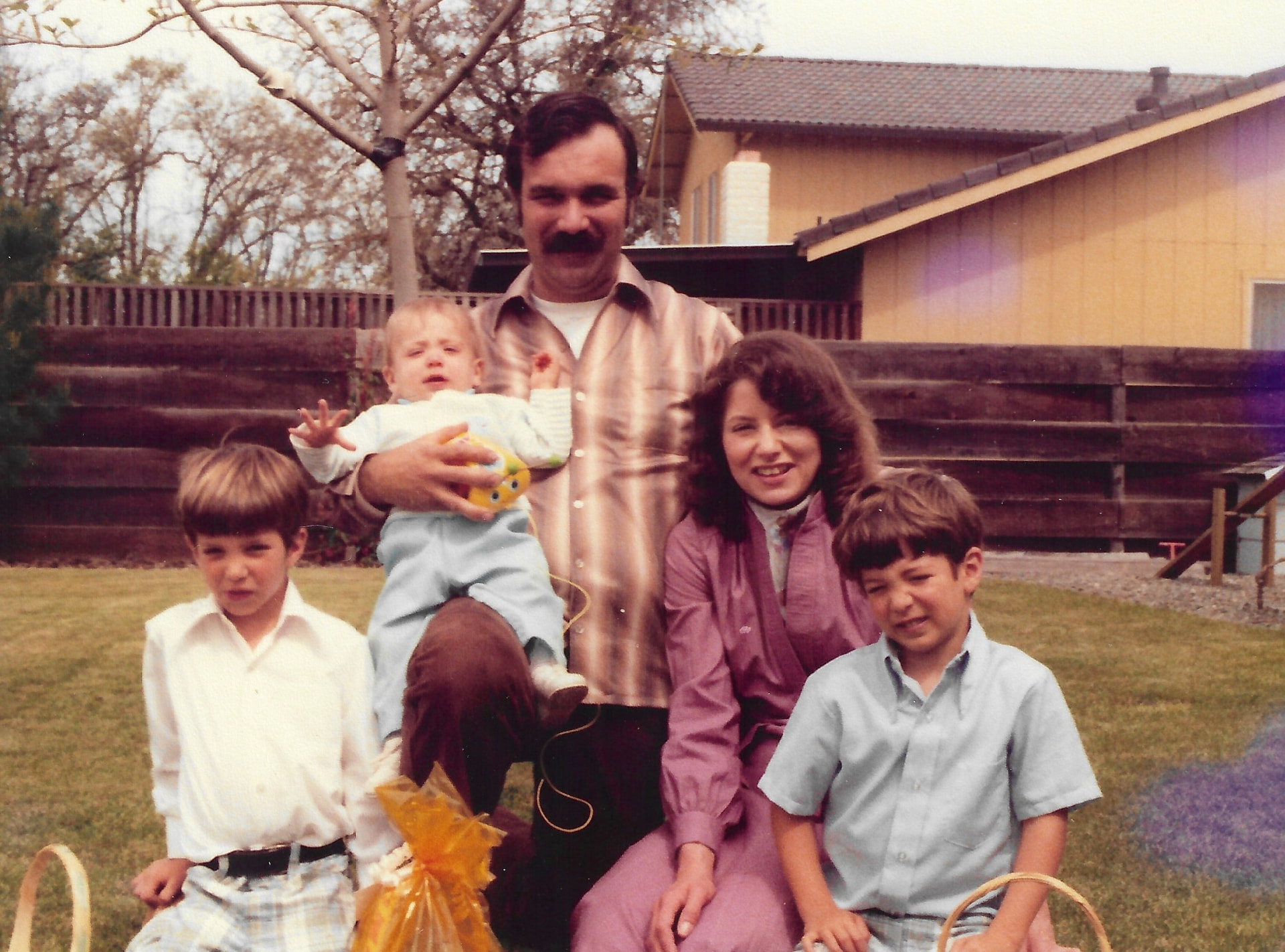 Andre with Gloria and their three sons in the kitchen