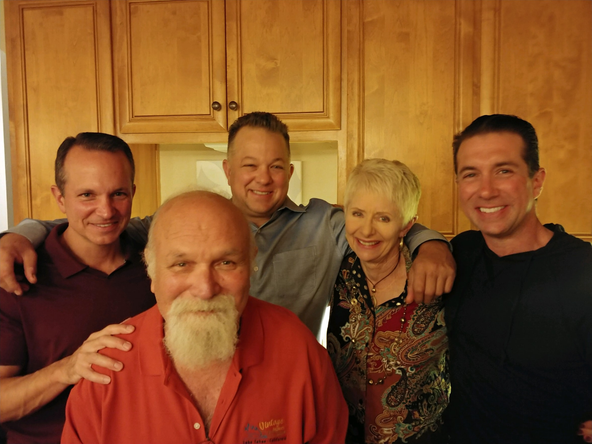 Andre and Gloria surrounded by their three adult sons