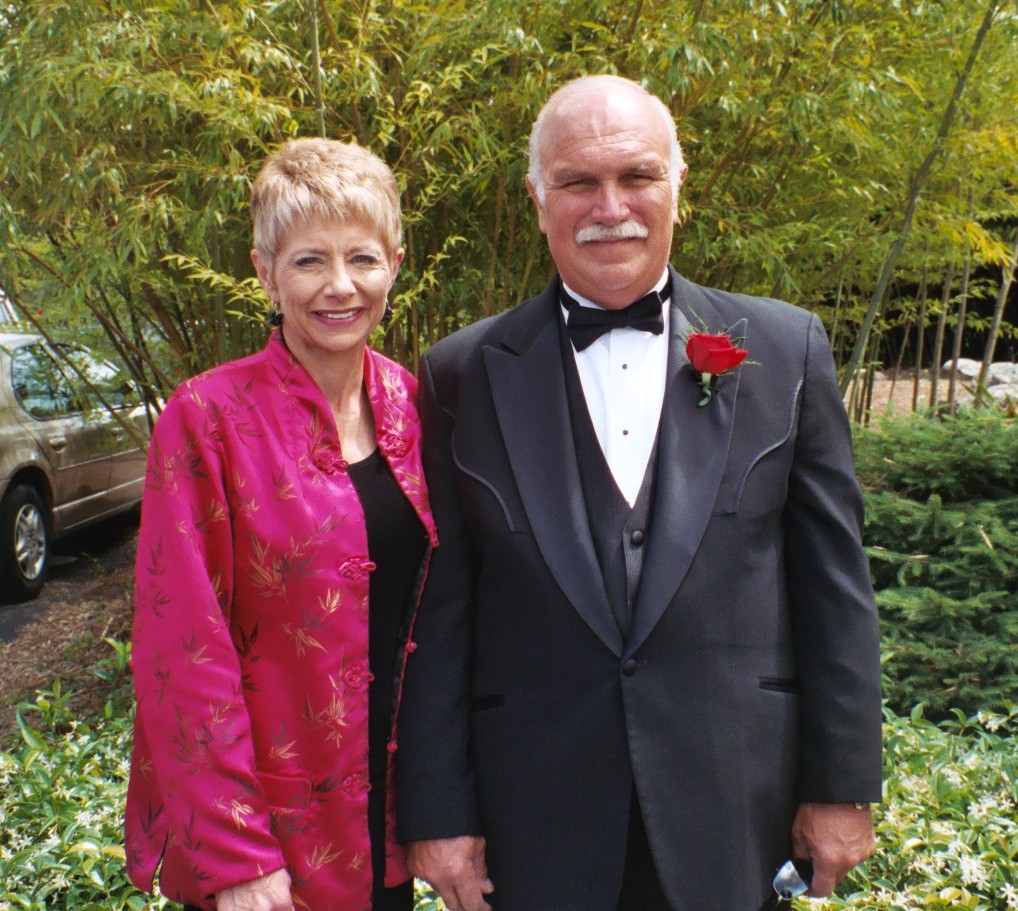 Andre and Gloria dressed for a celebration outdoors